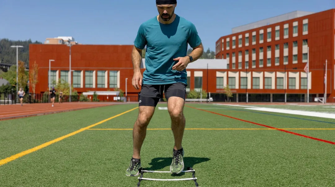 Athlete training outdoors in The Draper Tee, demonstrating COOLCORE® cooling technology and unrestricted movement during exercise.