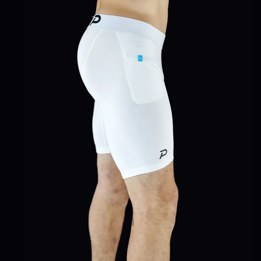 Rear-side view of white athletic shorts highlighting the secure waistband and tailored compression fit.