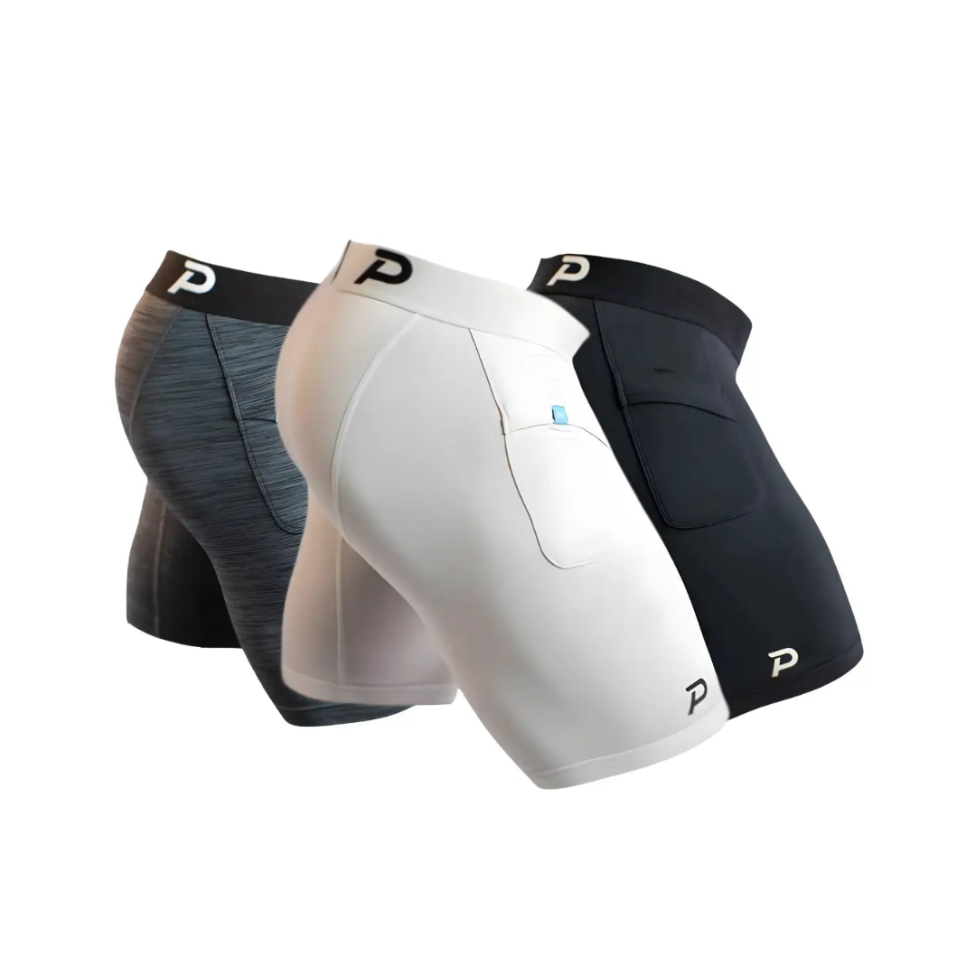 Pacterra Men's Middy 3-pack bundle in Heather Grey, White, and Black. These high-comfort compression shorts feature a secure, no-bounce side pocket and soft SwingLoft fabric for the best athletic fit.