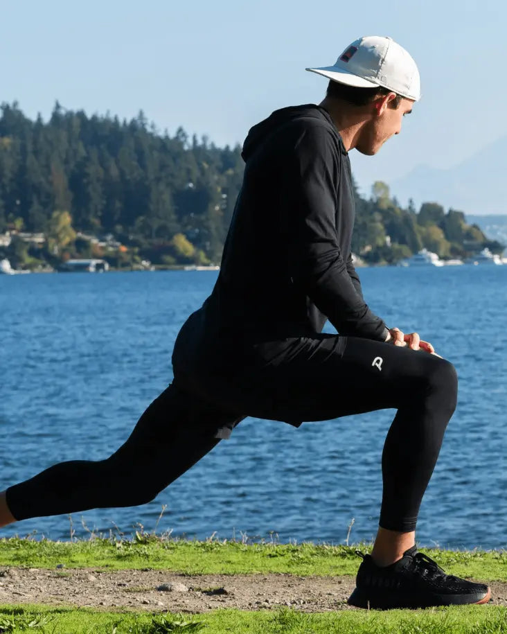 Athlete performing lunges in Pacterra Strider tights, showcasing the non-slip fit and technical support for high-intensity training.