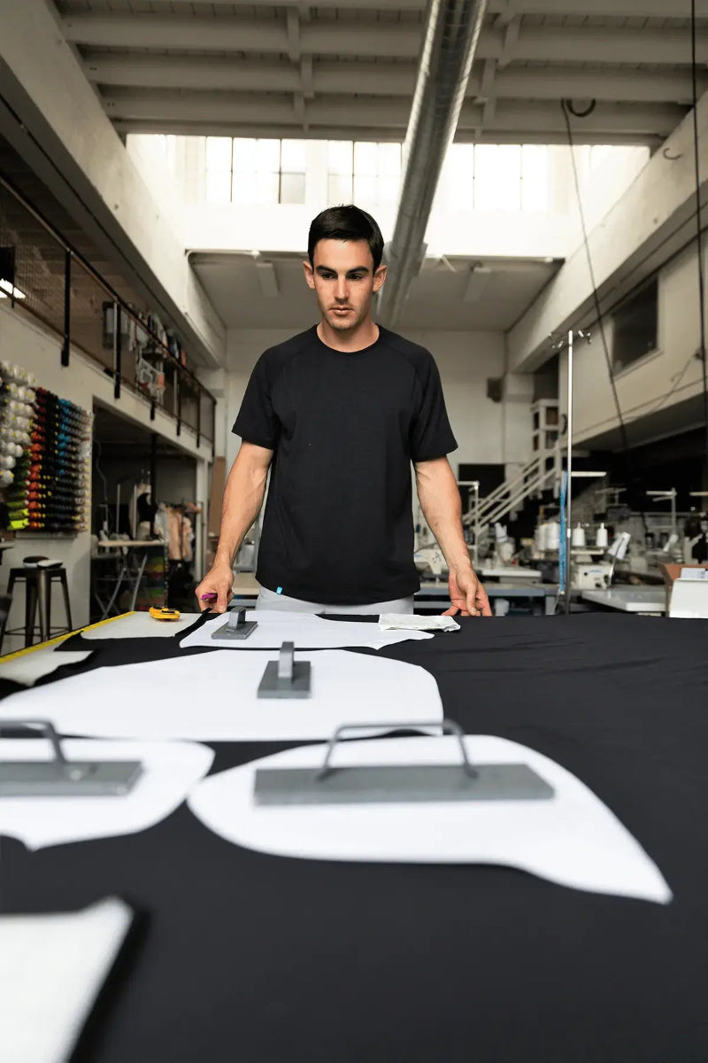 Pacterra Athletics founder Aaron Prosser designing high-performance men's compression gear in the studio.