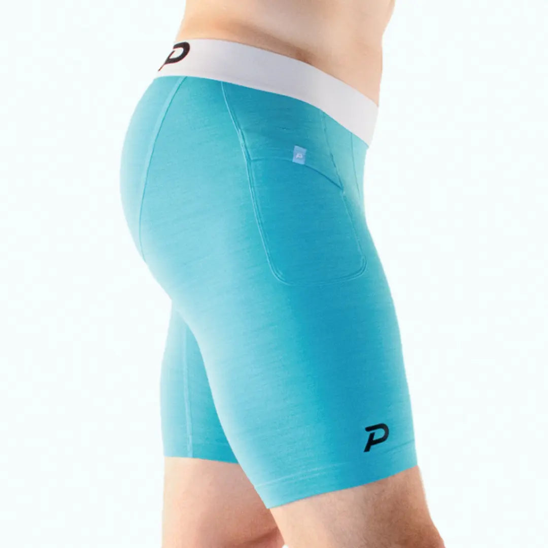 Side view of blue Pacterra shorts highlighting the ergonomic fit and ultra-soft performance material.