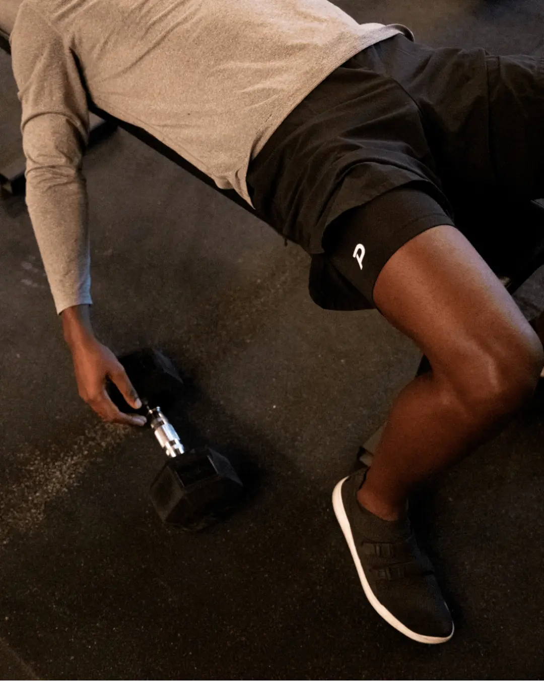 Athlete resting in Pacterra layered shorts, highlighting the comfort of a 2-pack rotation.