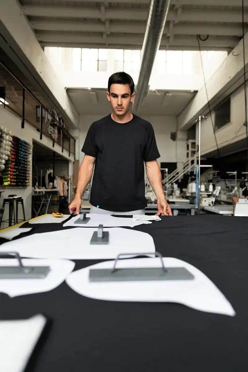 Pacterra Athletics founder Aaron Prosser designing high-performance men's compression gear in the studio.