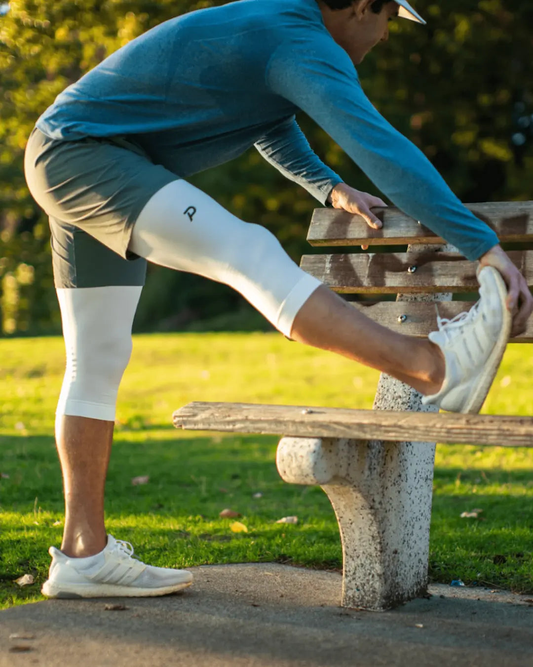 Side view of a male athlete in white 3/4 Strider tights, demonstrating the second-skin comfort and athletic silhouette