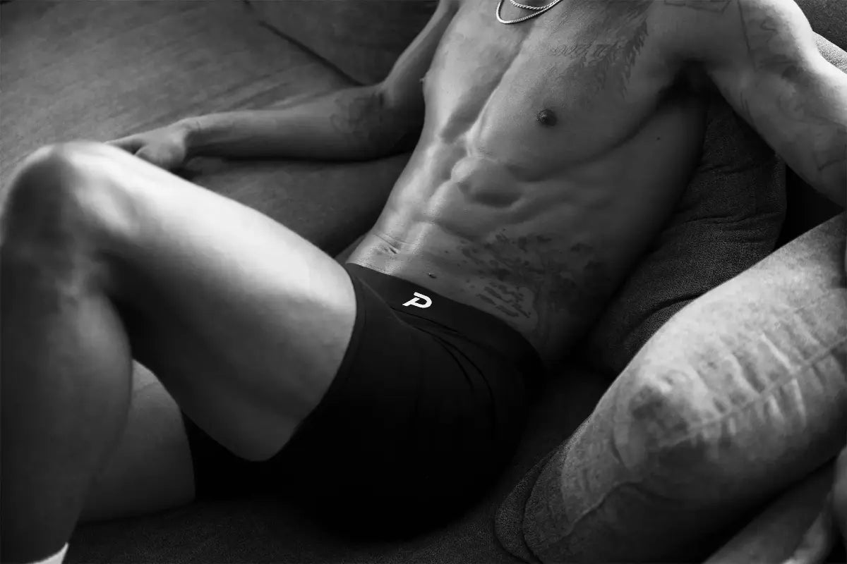 Close-up shot of an athlete wearing the extremely comfortable Pacterra mens Fiver boxer brief while relaxing.