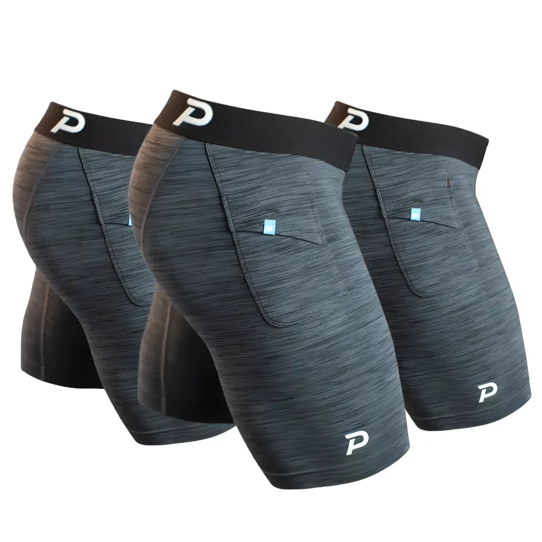 A 3-pack bundle of Pacterra Men's Middy compression shorts in Heather Grey. Showcasing the soft-touch SwingLoft fabric, comfortable elastic waistband, and signature secure side pocket for phone storage.